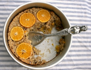 Baked oatmeal with oranges, sesame seeds, cacao nibs and ginger