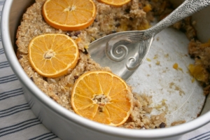 Baked oatmeal with oranges, sesame seeds, cacao nibs and ginger