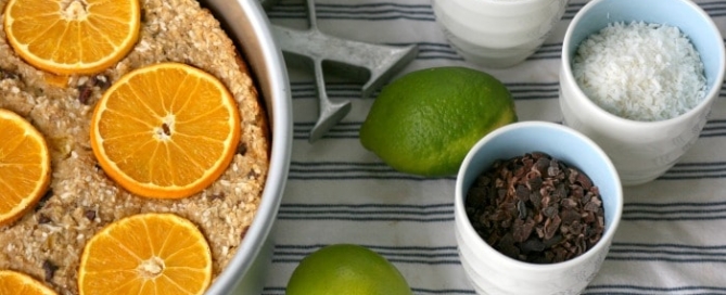 Baked oatmeal recipe with oranges sesame seeds and cacao nibs