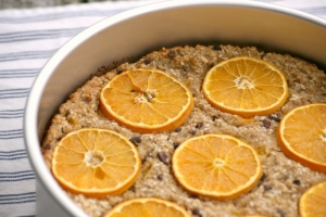 Baked oatmeal with oranges, sesame seeds, cacao nibs and ginger